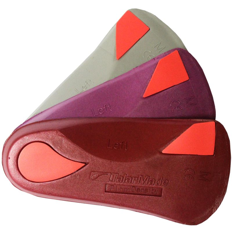 Three shoe insoles, one grey, one purple, one red