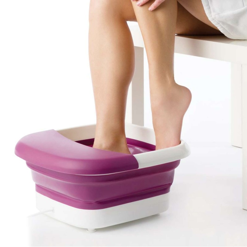 woman using the Beurer FB30 Foldable Foot Spa