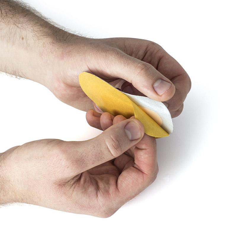 Remove the backing to affix the T-Form Pad to your insole